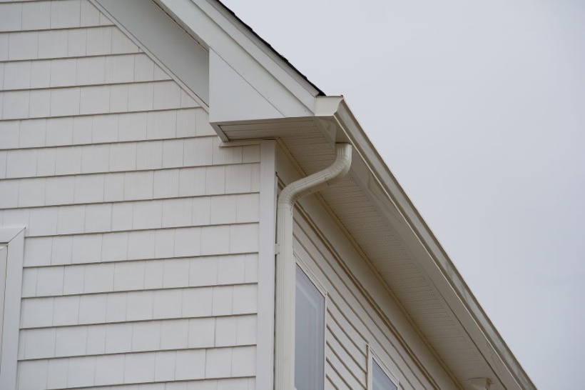 Front view of gutter on white residential home