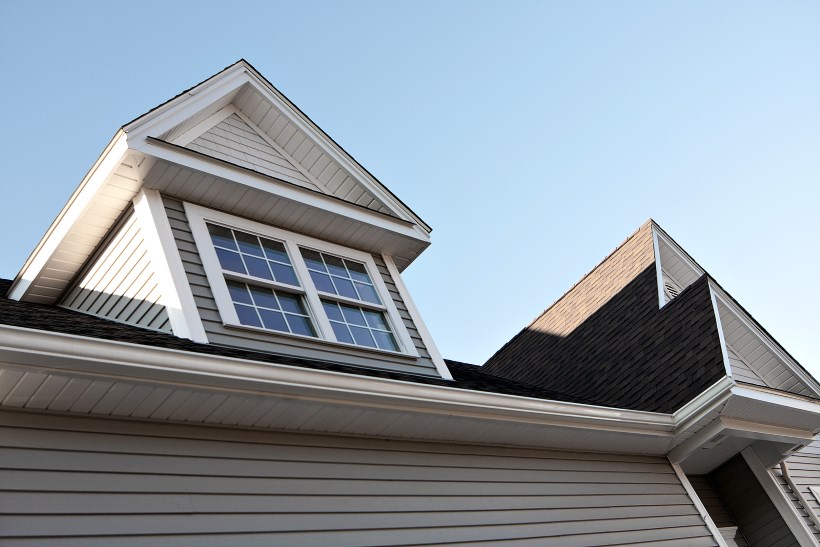 Bottom view of a soffit & fascia on a white residential home