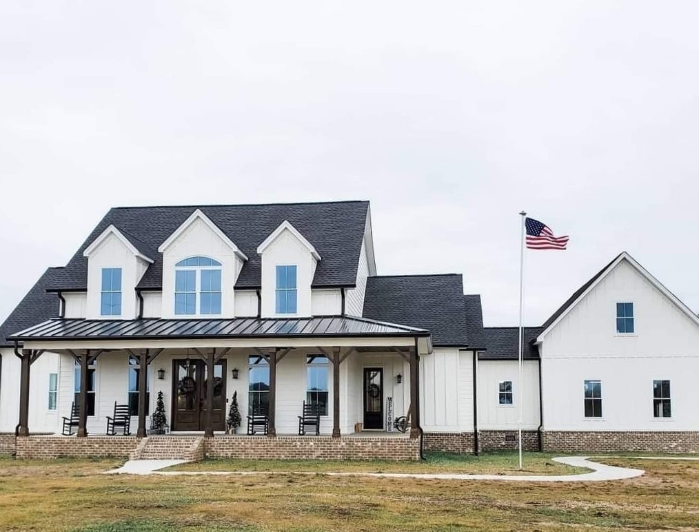 White home with newly installed exrterior and roofing by CCC Roofing